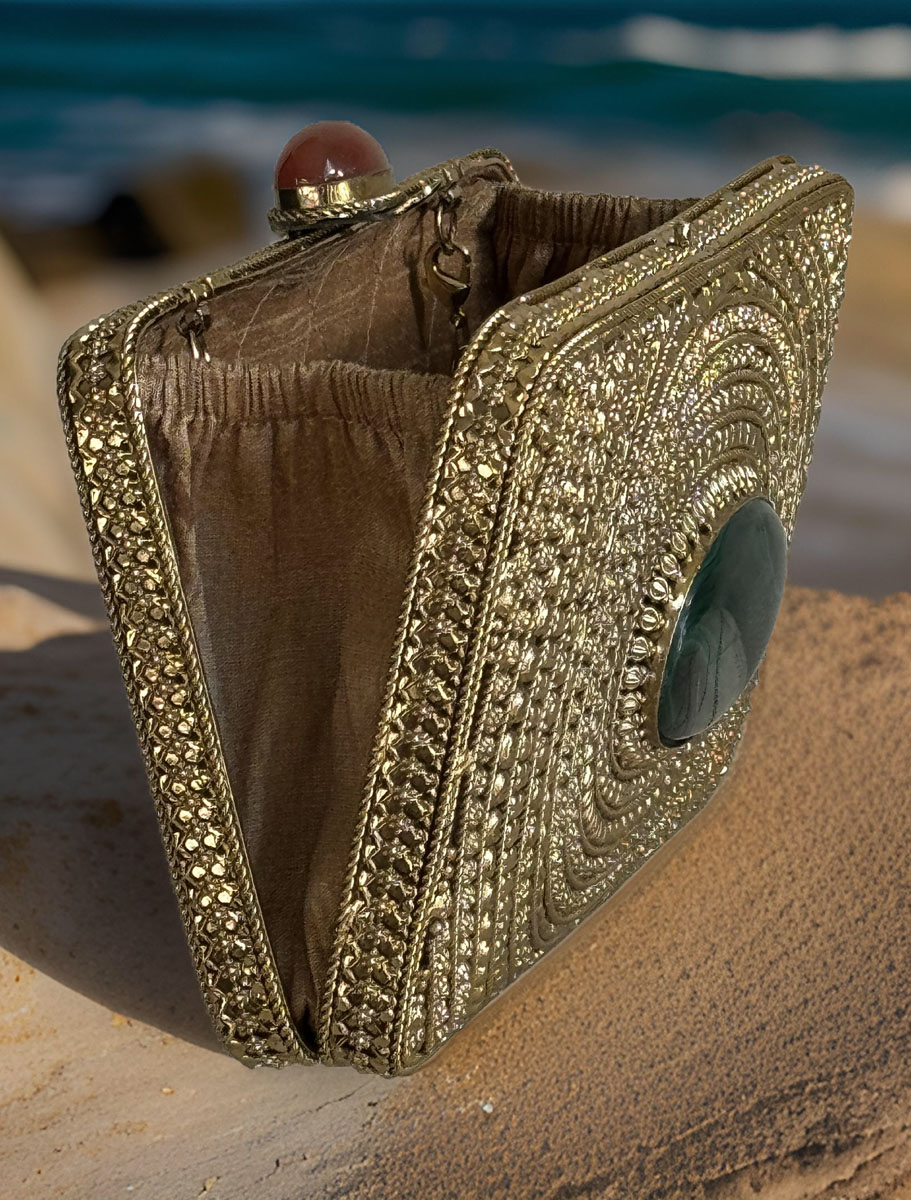 Matt Gold Intricate Designer Clutch with an Emerald Stone