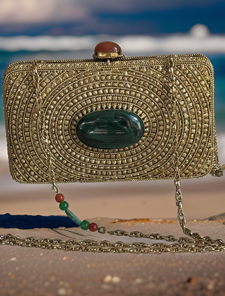 Matt Gold Intricate Designer Clutch with an Emerald Stone