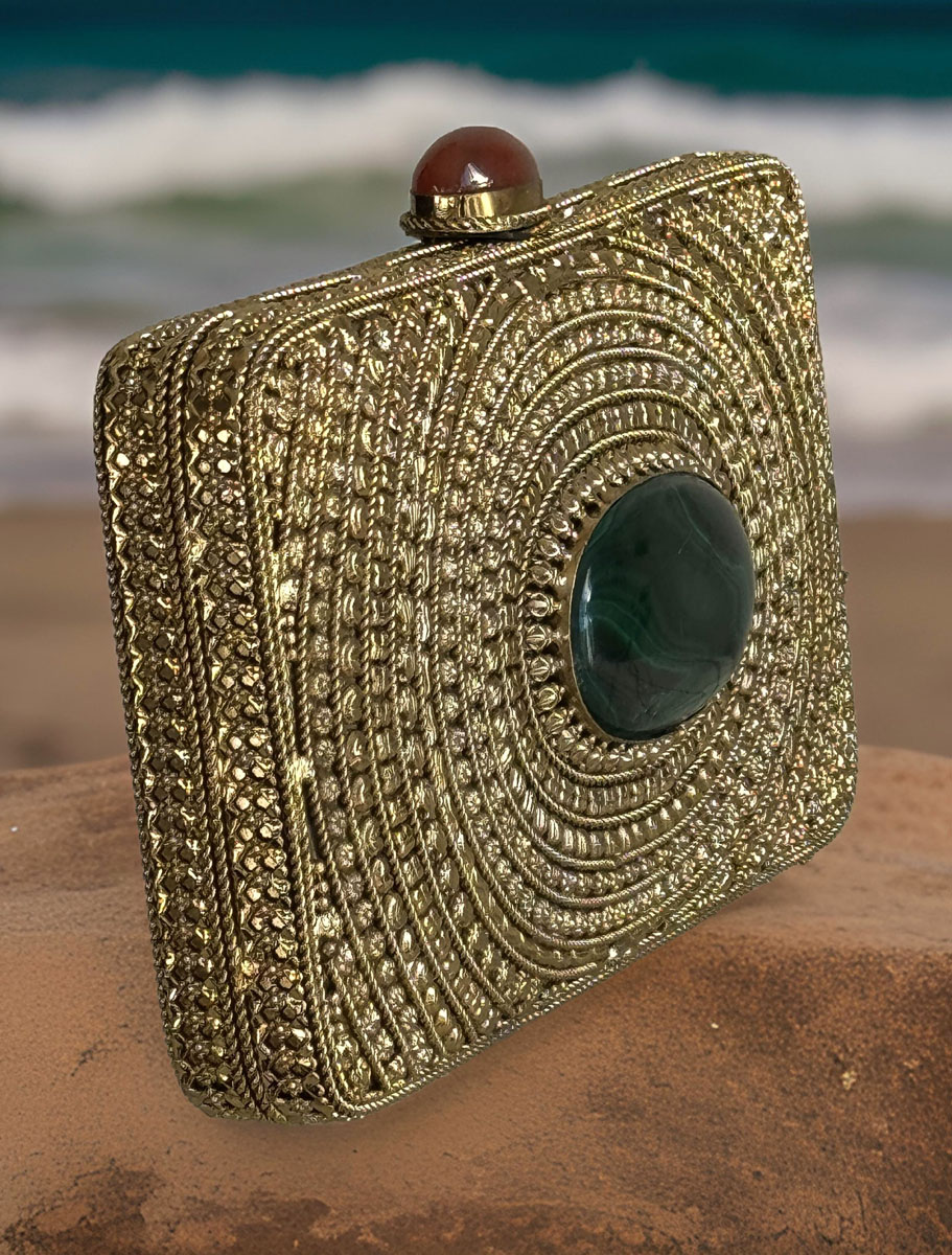 Matt Gold Intricate Designer Clutch with an Emerald Stone