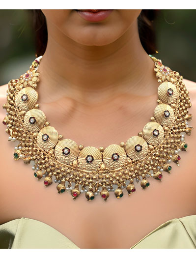 Beautifully Crafted Rajputi Style Gold plated Coin Shaped Choker Set with maangtika