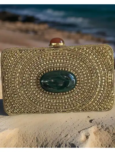 Matt Gold Intricate Designer Clutch with an Emerald Stone